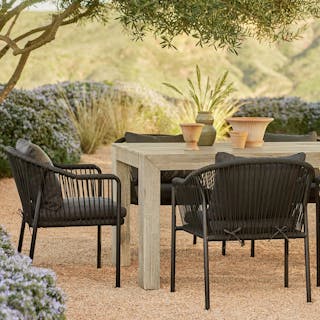 The Atica x Calicut Dining Bundle, contains products [Atica 71" Outdoor Dining Table - Washed Acacia] and [Calicut Outdoor Dining Chair - Coast Black].