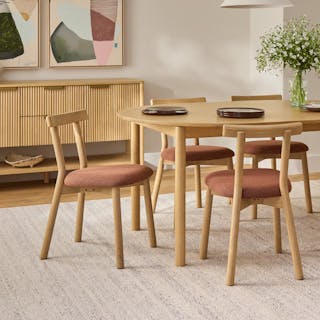 The Dine and Unwind Bundle, contains products [Heidi 48" - 67.75" Extendable Round Dining Table - White Oak] and [Ulka Dining Chair - White Oak and Ratine Oxide].