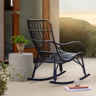 The Medan x Solina Bundle, contains products [Medan 24.5" Outdoor Rocking Lounge Chair - Graphite] and [Solina Outdoor Stool - Gray Terrazzo].