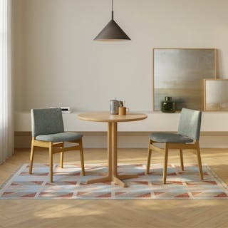 The Nosh Dining Chair x Odie Café Table Bundle, contains products [Nosh Dining Chair - Oak and Ratine Green] and [Odie Café Table - Natural Oak].